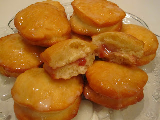 Glazed Jelly Doughnuts are soft and delicious homemade doughnuts filled with jelly and topped with a tasty glaze. Life-in-the-Lofthouse.com