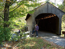 Jeri in front of a covered bridge in VT
