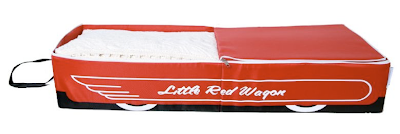 fabric under-bed storage box shaped like little red wagon, with those words written on it
