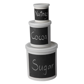 3 storage jars, different sizes; labeled in chalk as nutmeg, cocoa, and sugar
