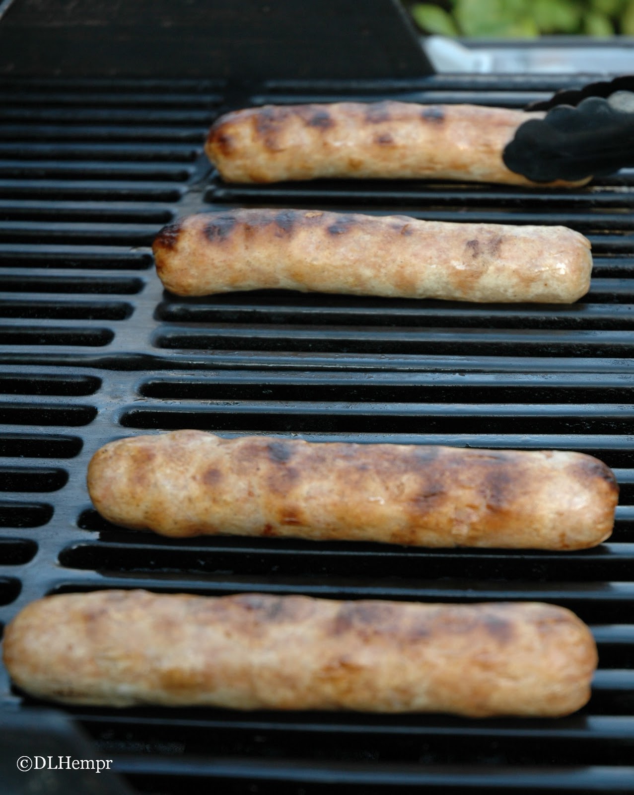Smart Cooking Brats on the Grill Topped with Caramelized Onion and Peppers