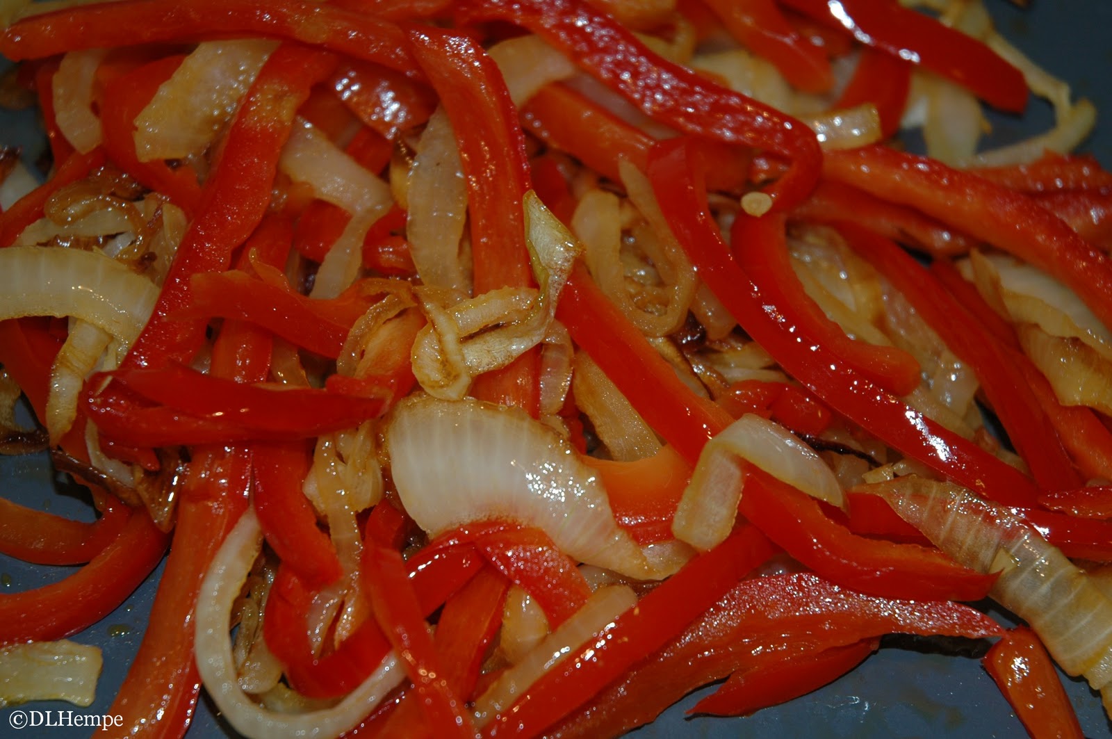 Smart Cooking Brats on the Grill Topped with Caramelized Onion and Peppers