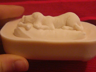 Picture of the side of the lab puppy goat milk soap - the puppy is in a down, and it has a bone beside it