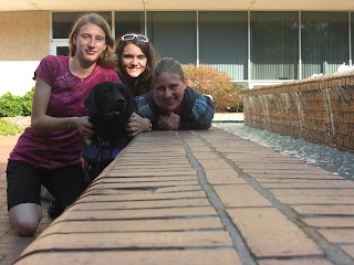Picture taken from a camera stand - picture of me, My friend, my sister, and Sparkie beside the water fountain