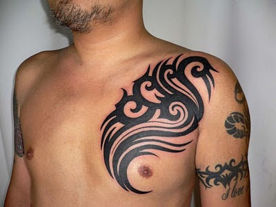 Tribal Tattoo on Male Chest and Arm