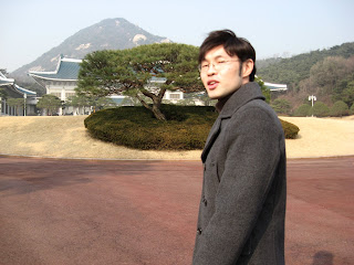 Mr Lee in front of main building