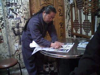 Andy's makkuli guy doing calligraphy