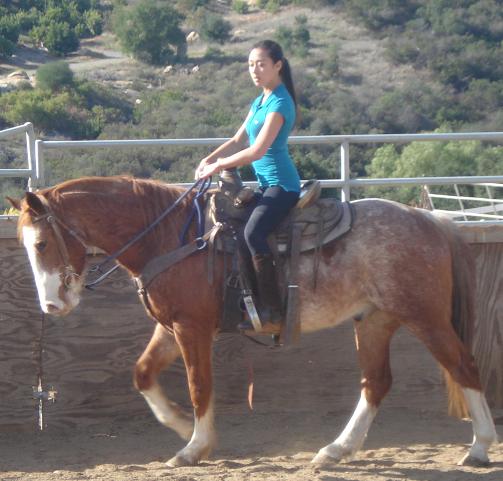 Volunteer Chiara riding Shasta