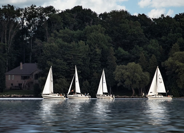Small sailboats in early evening on Lake Couchiching