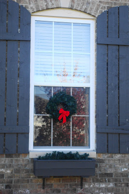 attach wreaths with ribbon on windows
