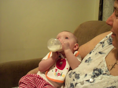 Look Gran  I am holding my bottle already