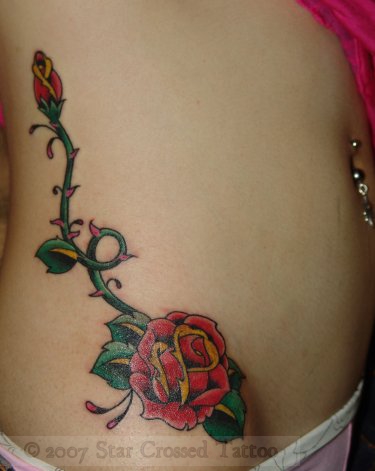 flower tattoo on the hip