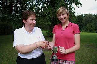 Captain Lesley presents trophy to Emma-click to enlarge