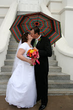 My man and I kissing in the rain on our wedding day!