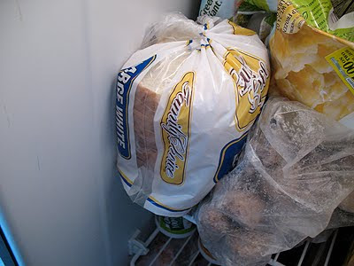 A close up photo of a loaf of bread in the freezer.