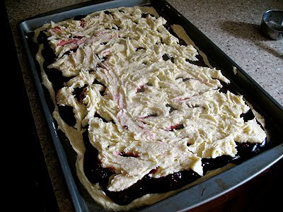 A photo of a sheet of unbaked blackberry pie squares.