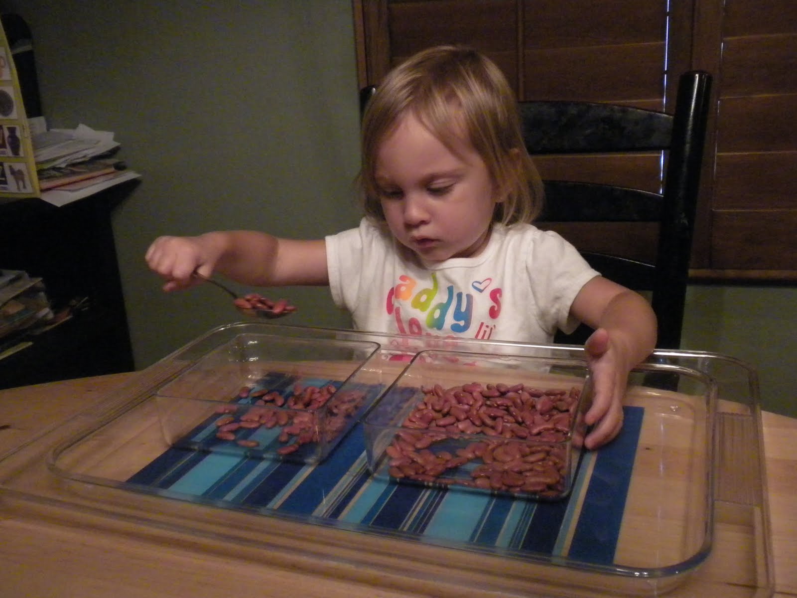 Pigtails and tutus: Transferring beans with spoon