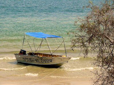 photo of a skiff anchoreded off the Spit