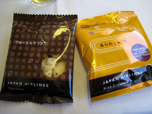 Rice crackers and nuts packages in JAL Business Class