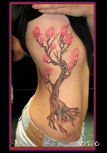 tattoos for women on ribs. tree tattoos for women.