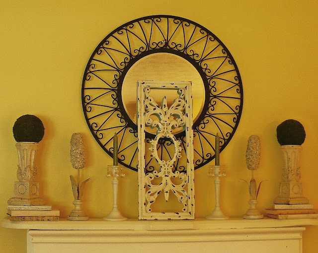 decorated fireplace mantel with altered books